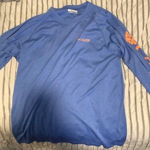 Medium blue with orange lettering Columbia fishing shirt.